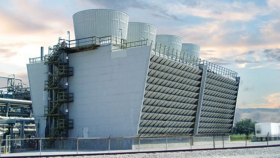 large cooling towers at sunset