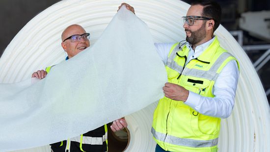 image of two people holding tissue, paper, pulp, tissue, towel, Andritz, TIAC, collaboration, partnership