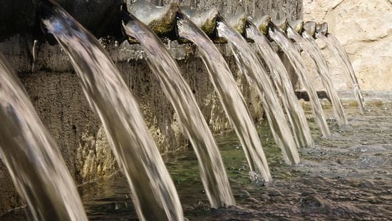 water flowing from a set of pipes