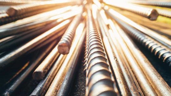 Close up image of light shining off steel bars.